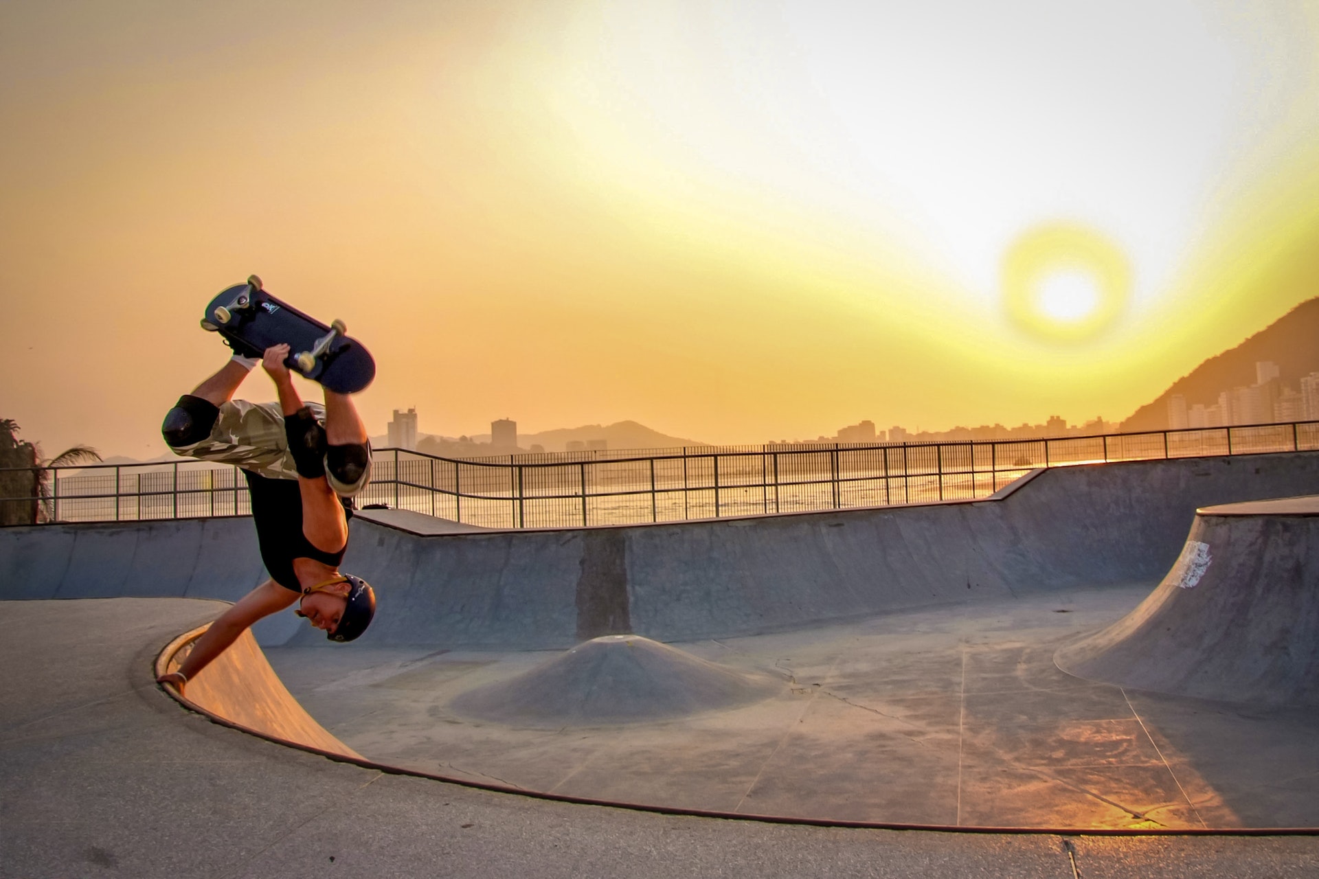 man-in-black-tank-top-skateboarding-wearing-helmet-700953.jpg