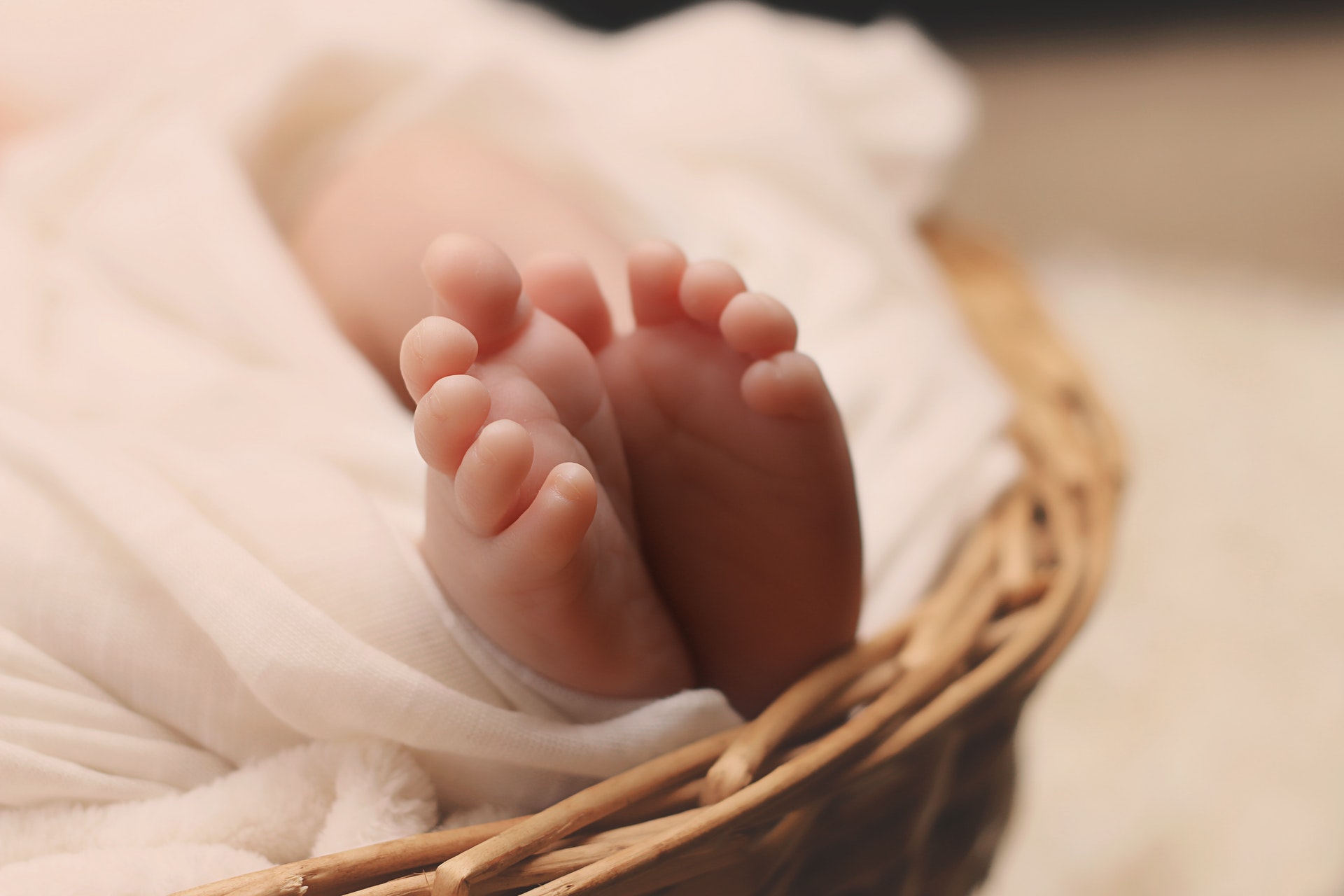 baby-s-feet-on-brown-wicker-basket-161534.jpg